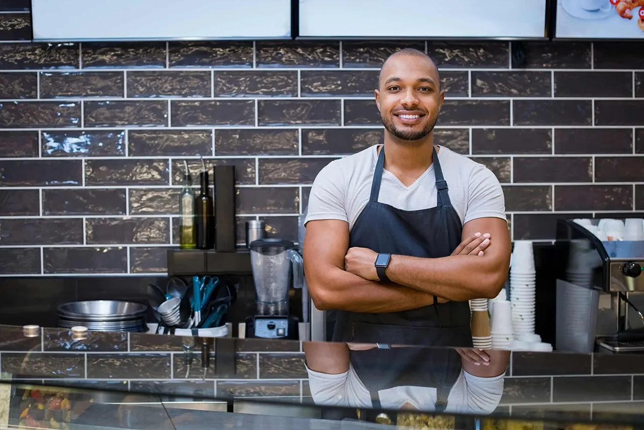 Male barista in an apron